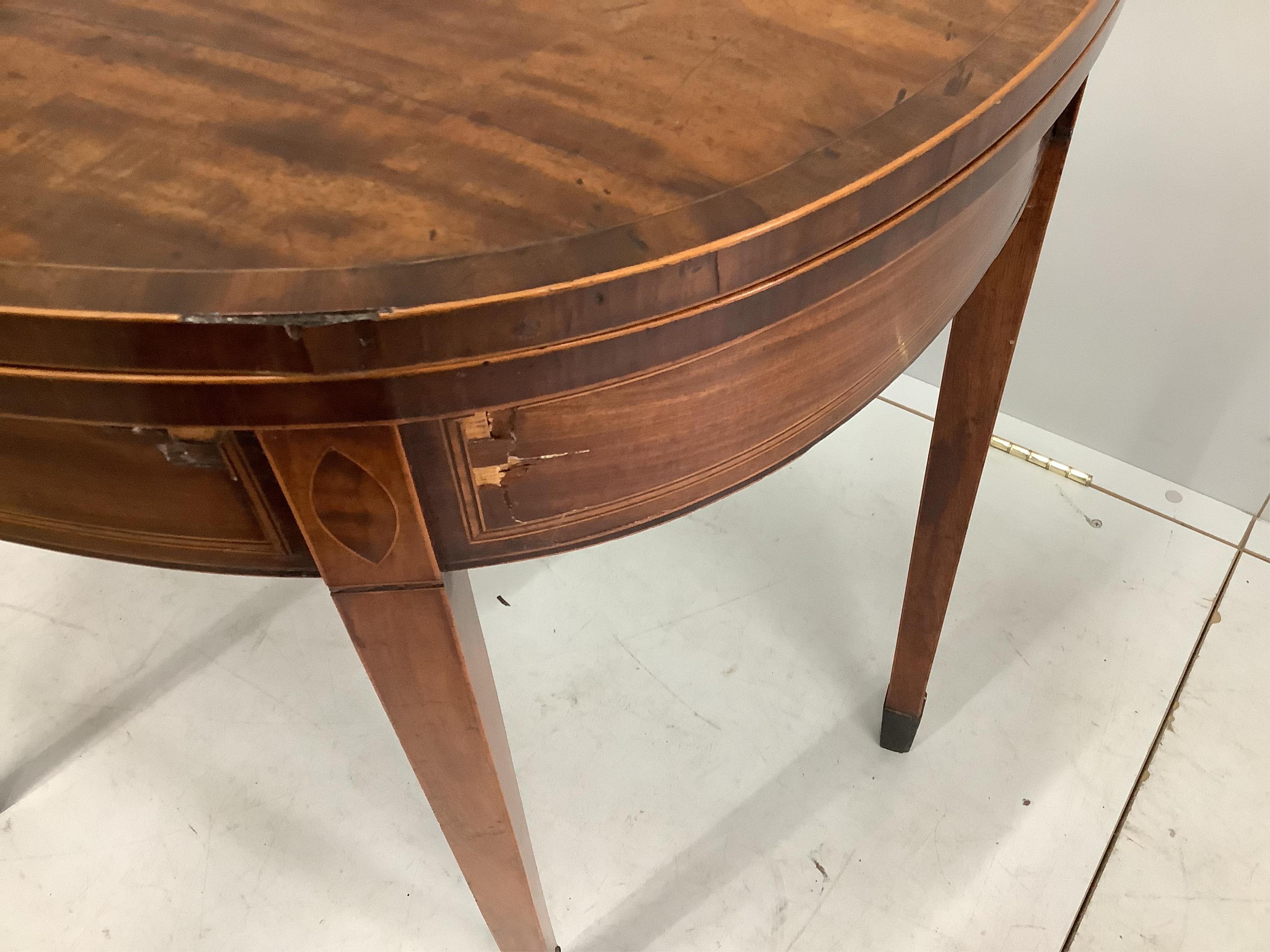 A George III inlaid mahogany tea table, width 92cm. Condition - poor